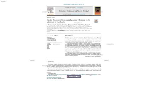 Chaotic dynamics of two coaxially-nested cylindrical shellsreinforced by two beams